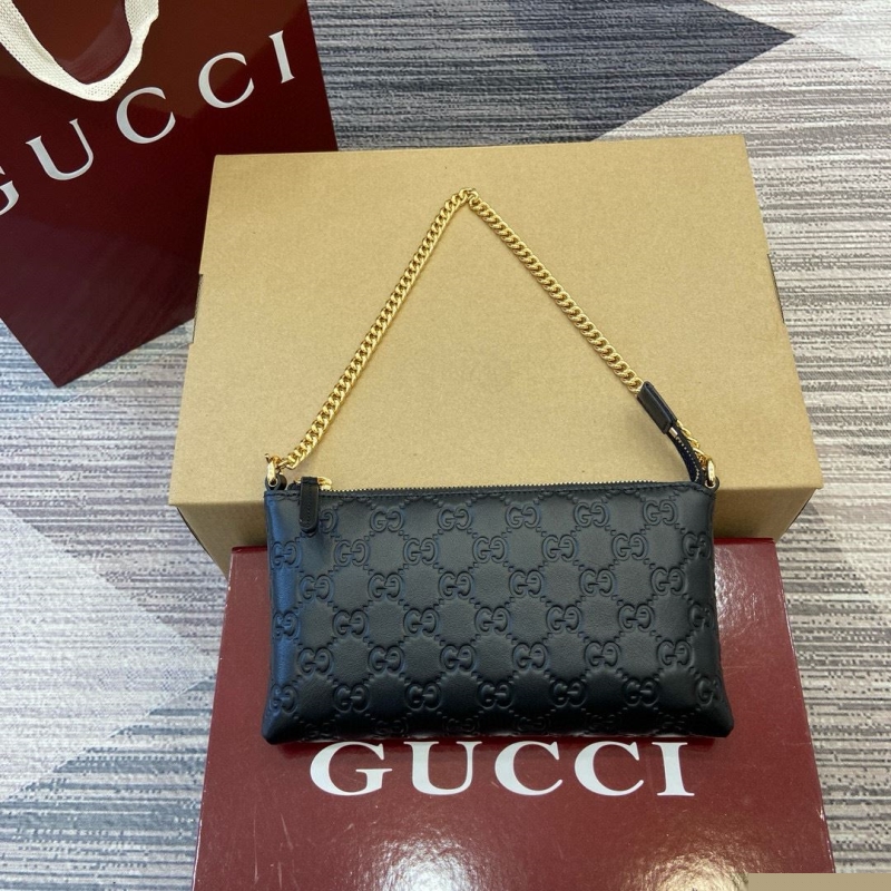 G*u*i top handle bags